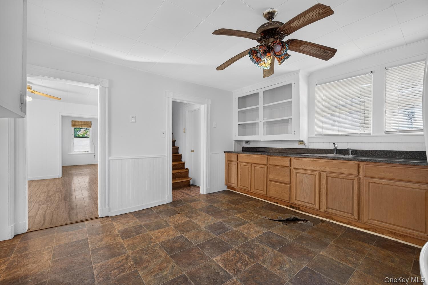 49 Cedar Street Babylon, NY 11702 - Photo 8 of 20 a large white kitchen with a sink
