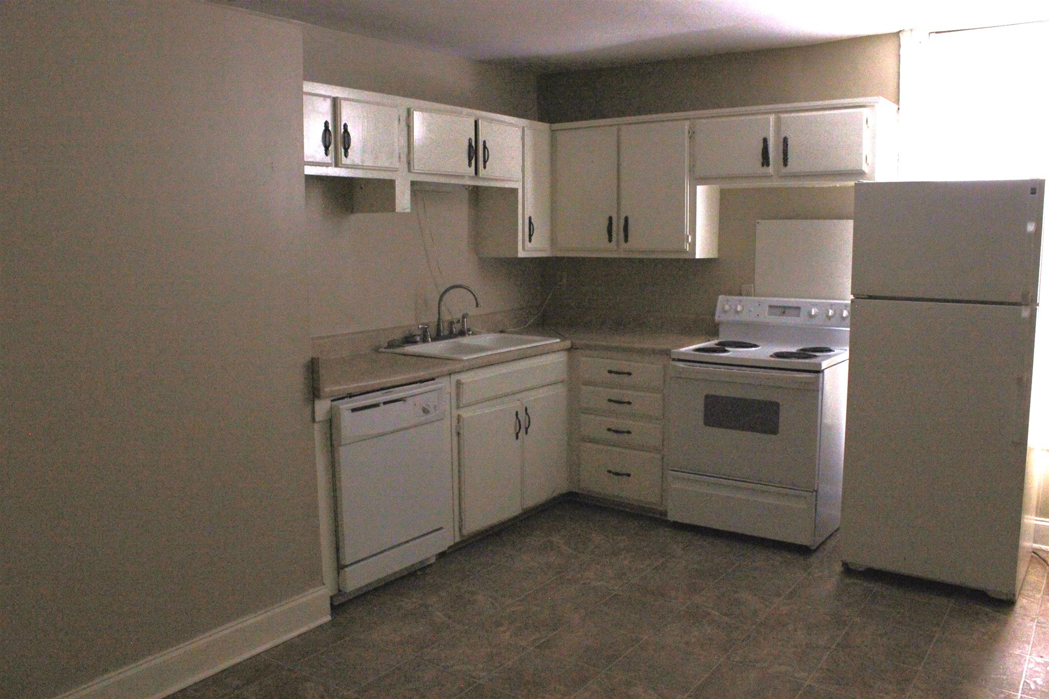 322 North Oak Street Springfield, TN 37172 - Photo 9 of 14 a kitchen with cabinets appliances and a sink