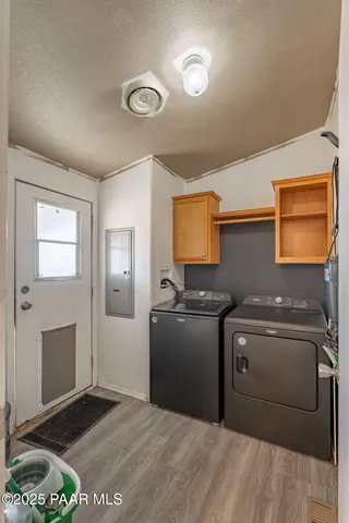a kitchen with stainless steel appliances granite countertop a stove and a refrigerator