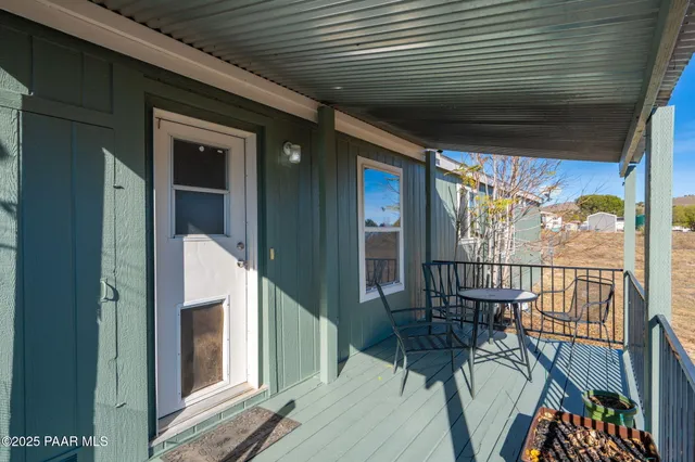a view of balcony with furniture
