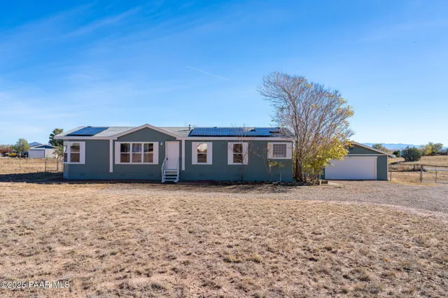 a front view of a house with yard