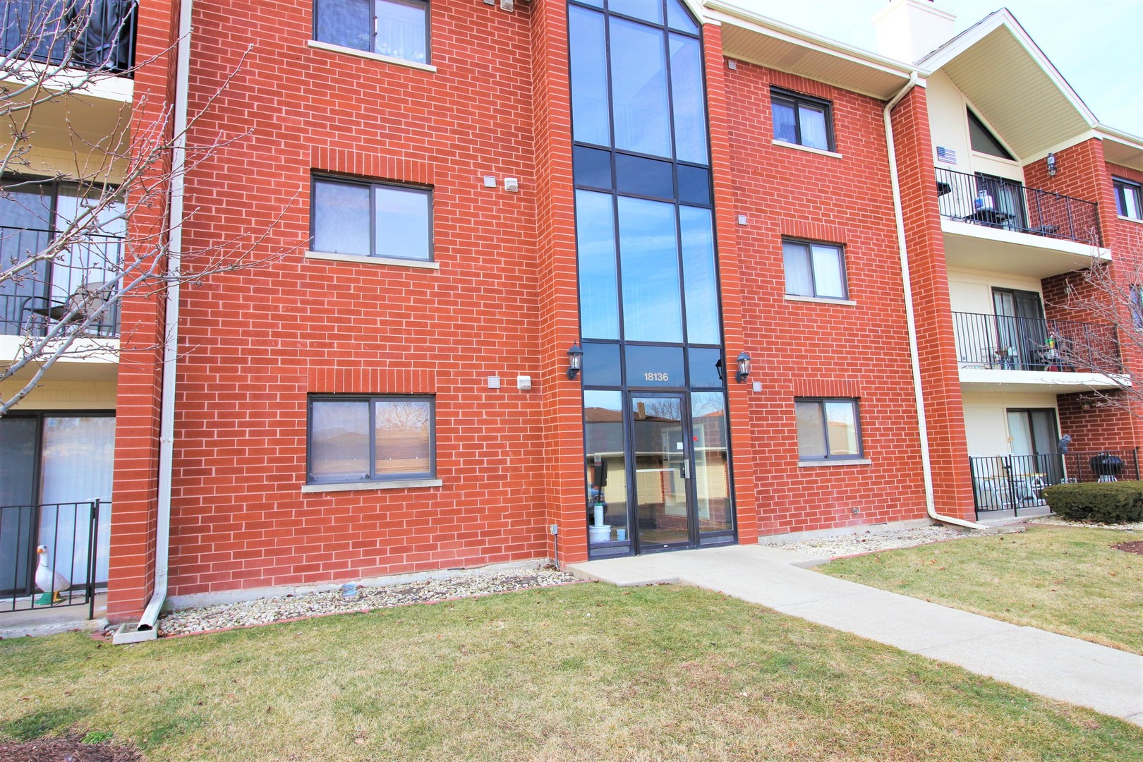 18136 Rita Road, Unit 1A Tinley Park, IL 60477 - Photo 1 of 19 a front view of a building