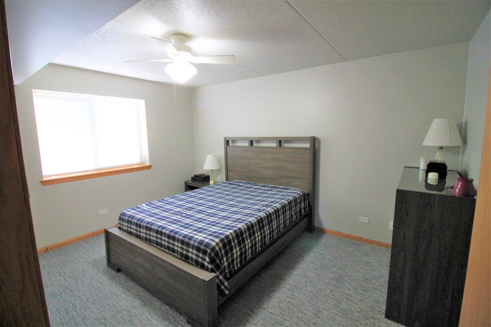18136 Rita Road, Unit 1A Tinley Park, IL 60477 - Photo 13 of 19 a bedroom with a bed and window