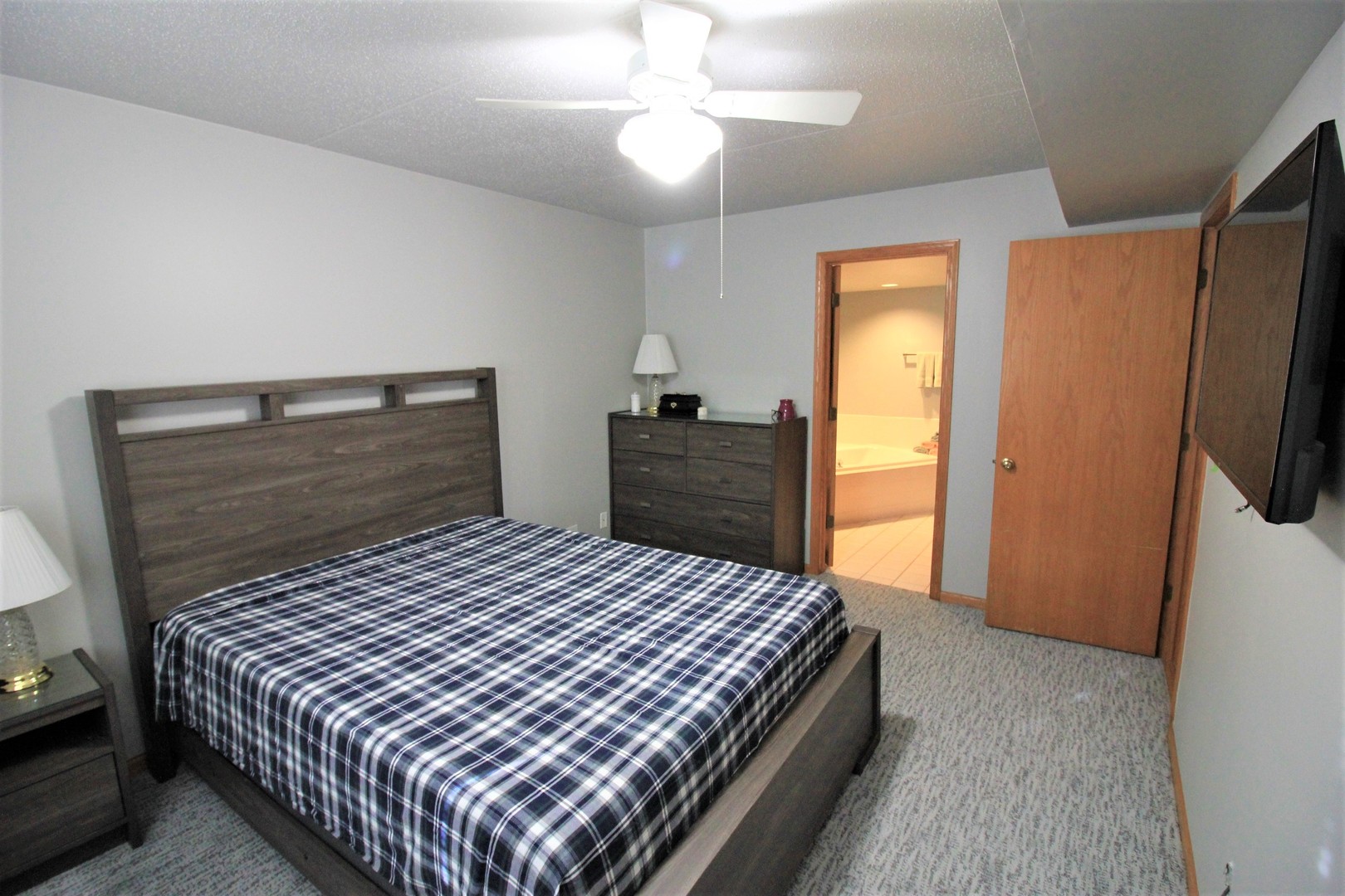 18136 Rita Road, Unit 1A Tinley Park, IL 60477 - Photo 14 of 19 a bedroom with a bed and a dresser