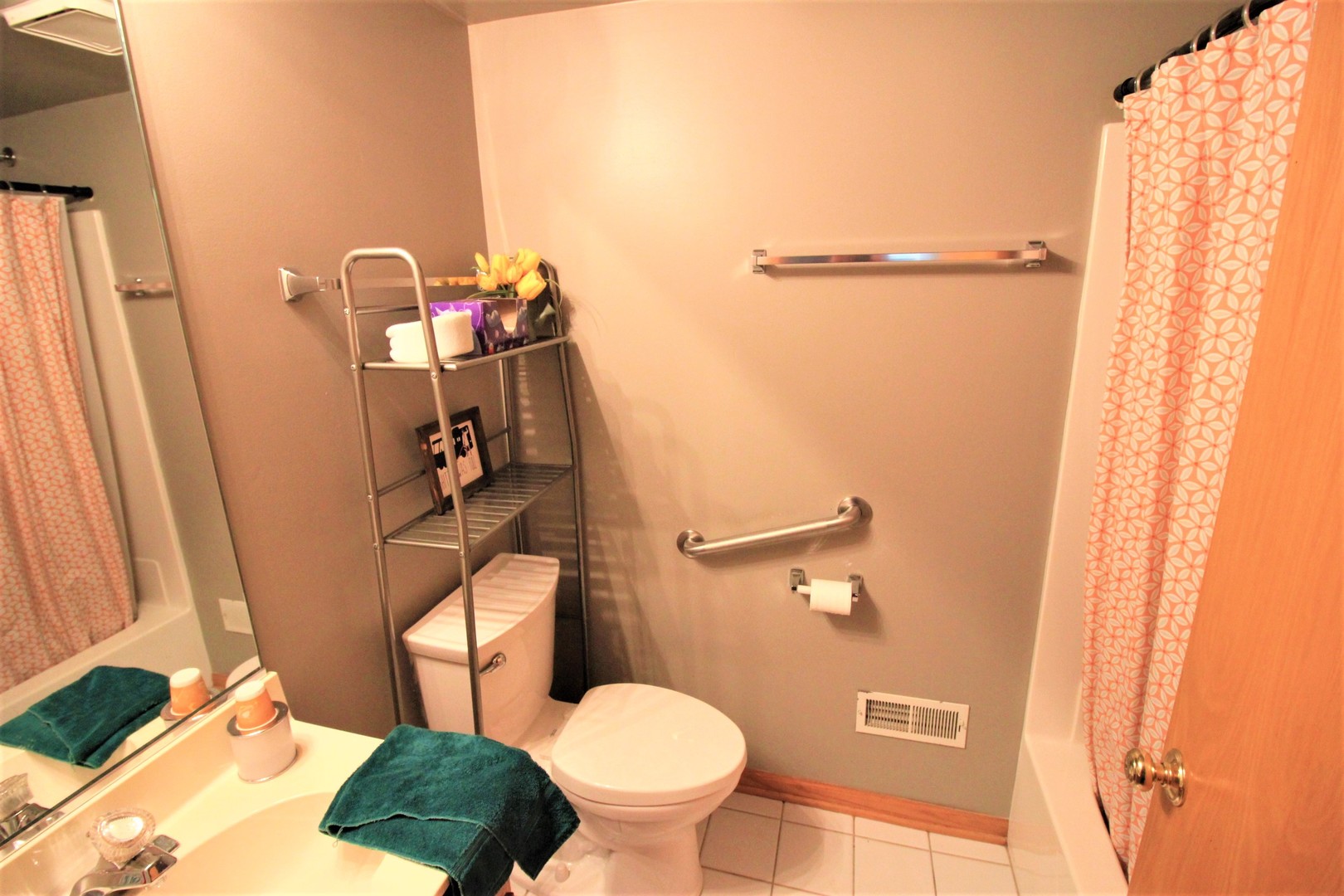 18136 Rita Road, Unit 1A Tinley Park, IL 60477 - Photo 16 of 19 a bathroom with a toilet and a shower curtain