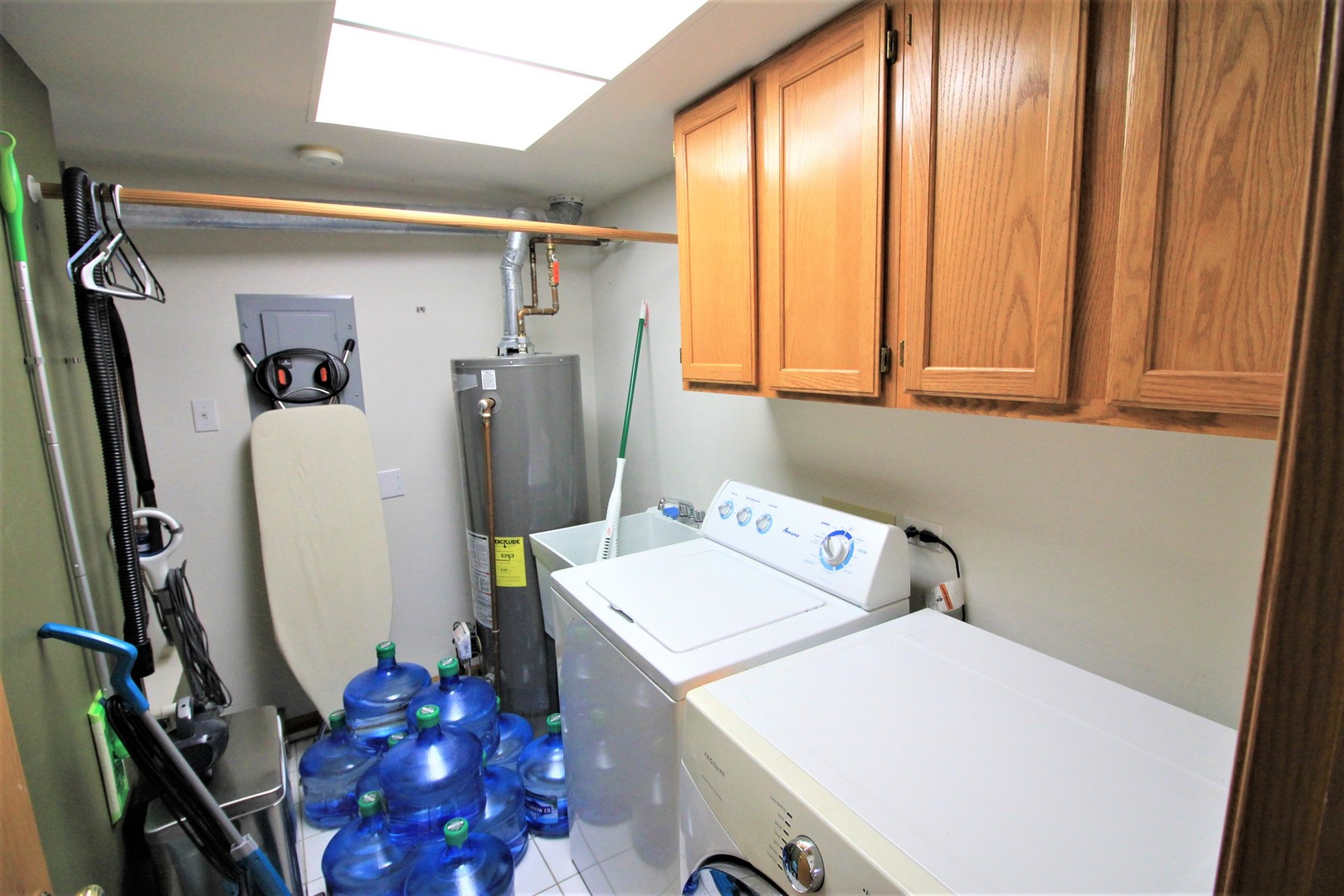 18136 Rita Road, Unit 1A Tinley Park, IL 60477 - Photo 18 of 19 a utility room with dryer and washer