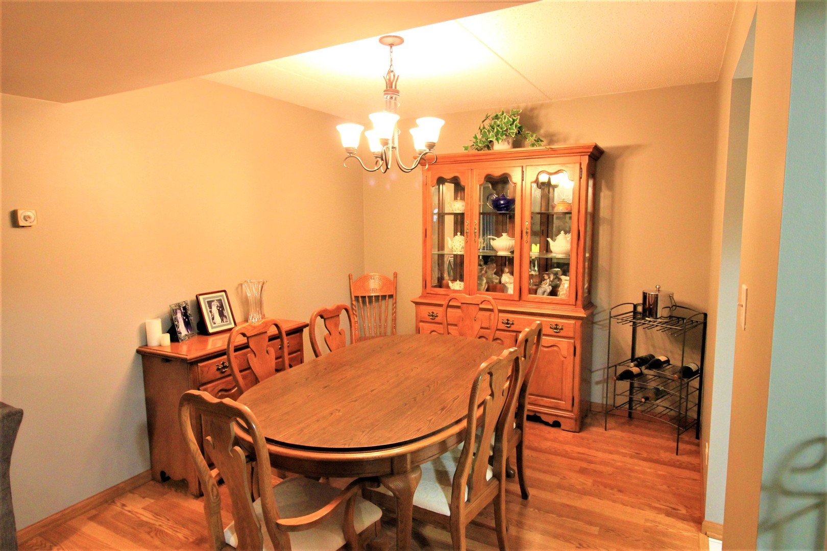 18136 Rita Road, Unit 1A Tinley Park, IL 60477 - Photo 6 of 19 a balcony dining table and chairs
