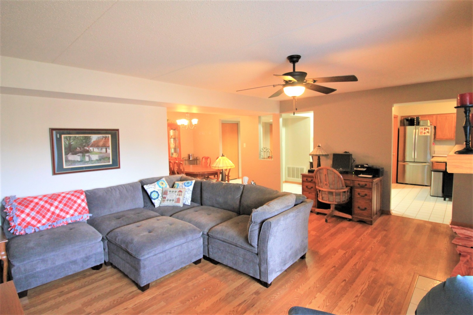 18136 Rita Road, Unit 1A Tinley Park, IL 60477 - Photo 10 of 19 a living room with furniture and a chandelier