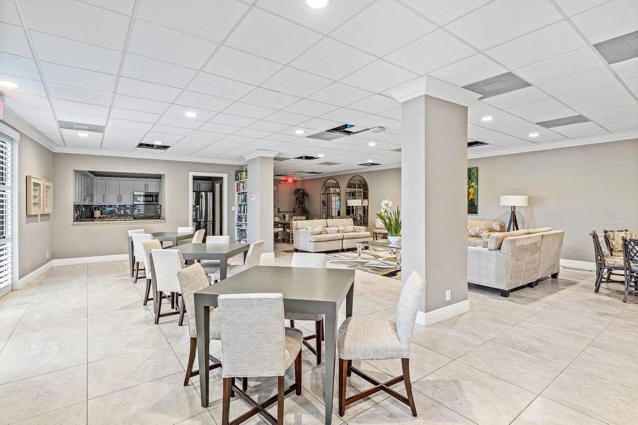 4545 North Ocean Boulevard, Unit 18D Boca Raton, FL 33431 - Photo 19 of 28 a view of a dining room kitchen with furniture and a rug