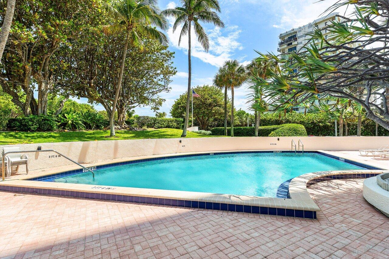 4545 North Ocean Boulevard, Unit 18D Boca Raton, FL 33431 - Photo 20 of 28 a view of a yard with a bench