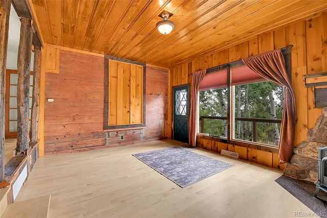 a view of front door with yard