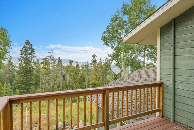 a view of a balcony with wooden fence