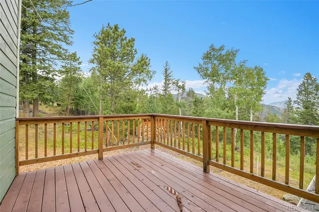 a view of balcony with wooden floor