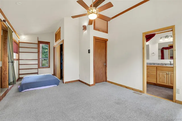 a view of hallway with stairs and toys