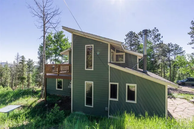 a backyard of a house with lots of green space