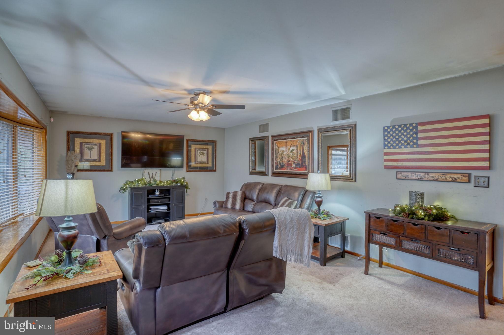 31674 Hickory Manor Road Frankford, DE 19945 - Photo 12 of 53 a living room with furniture and a flat screen tv