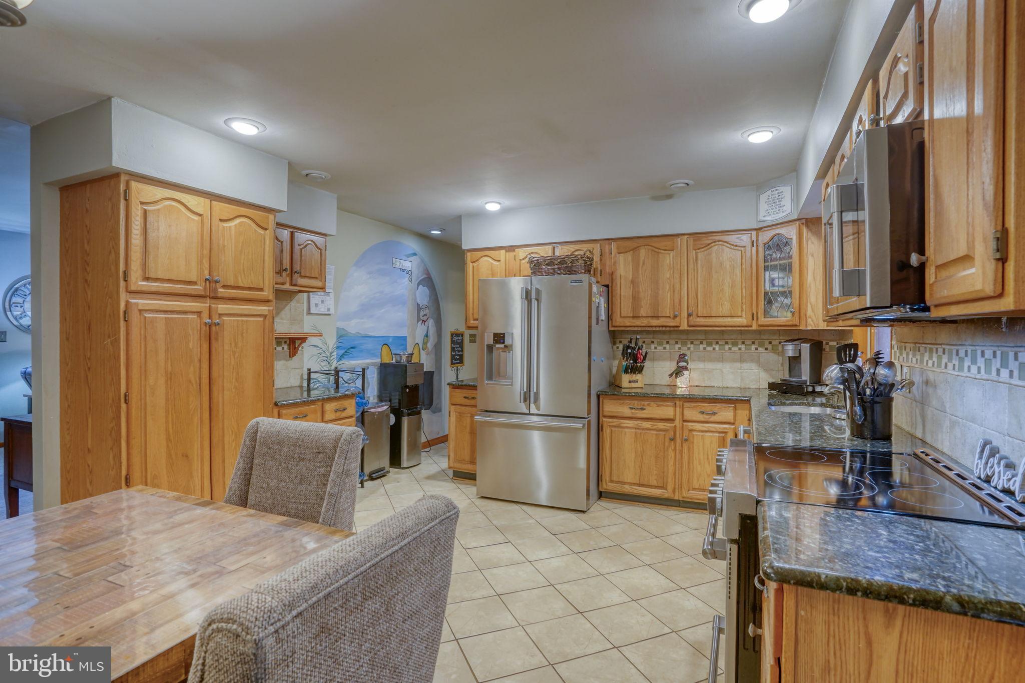 31674 Hickory Manor Road Frankford, DE 19945 - Photo 21 of 53 a kitchen with refrigerator and cabinets