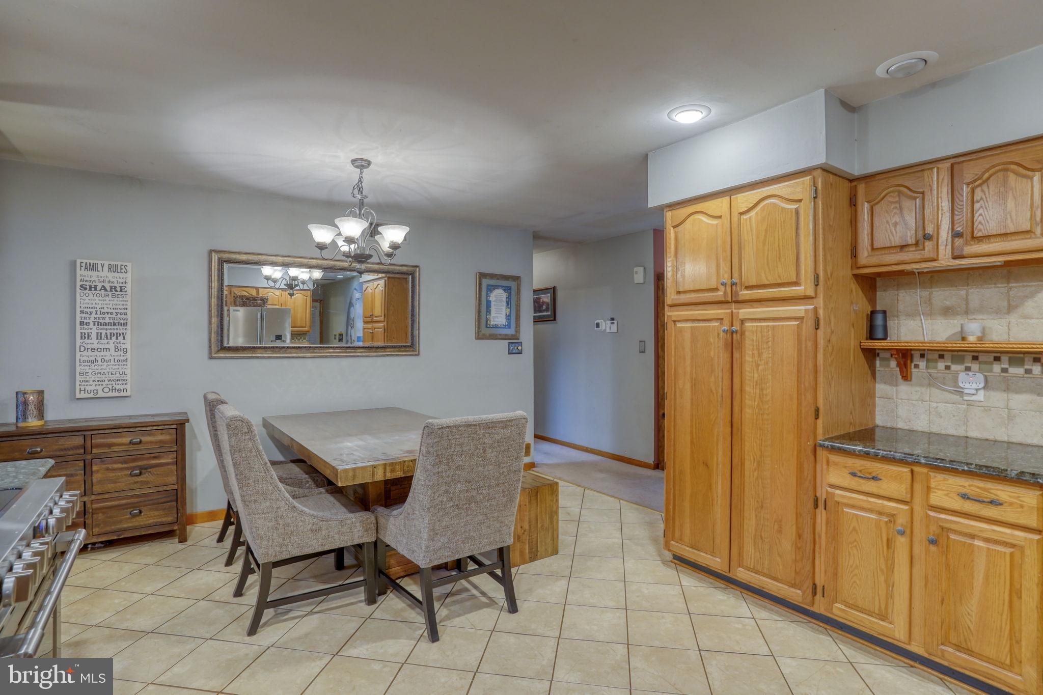 31674 Hickory Manor Road Frankford, DE 19945 - Photo 23 of 53 a dining room with furniture and chandelier kitchen view