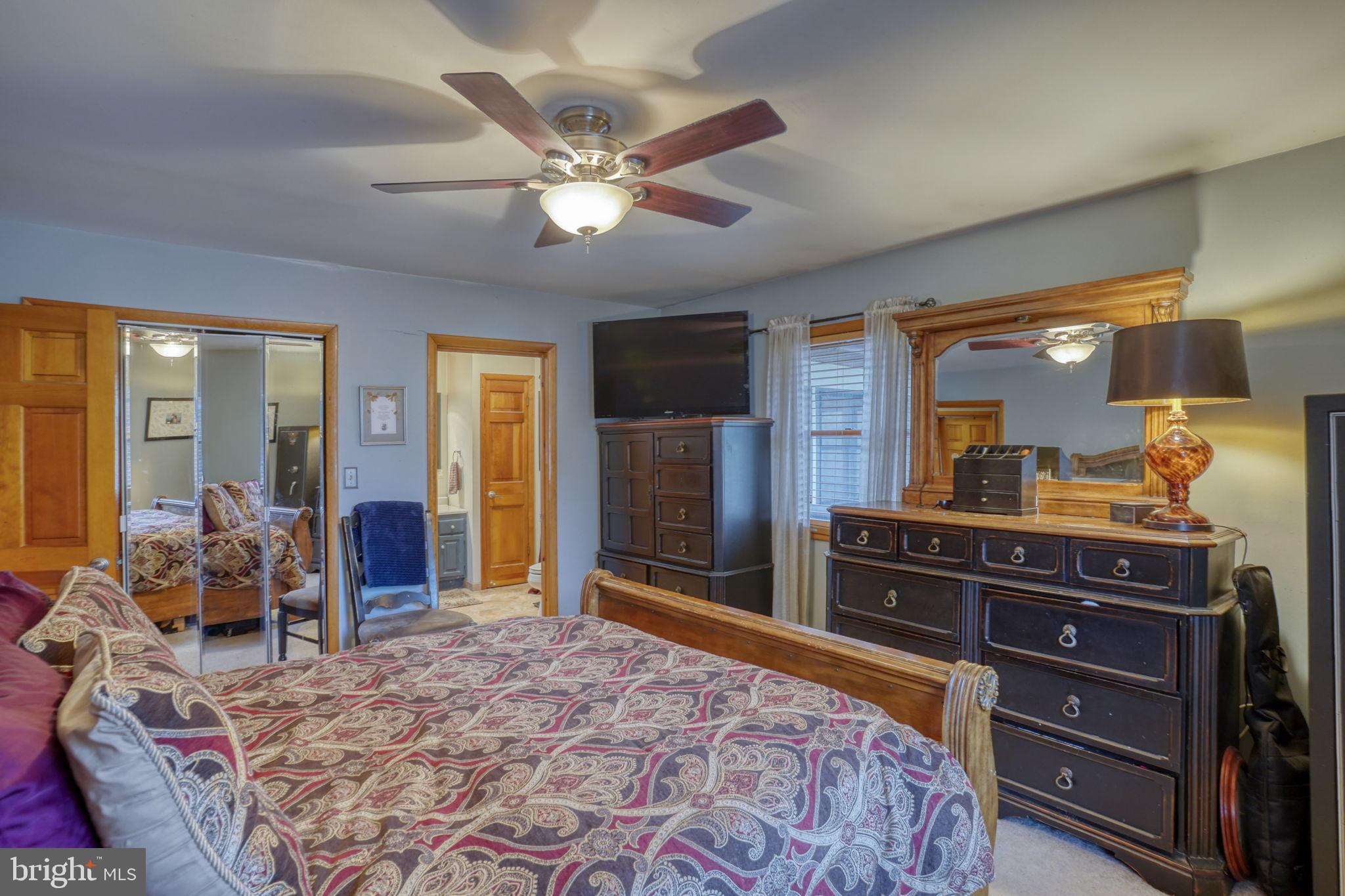31674 Hickory Manor Road Frankford, DE 19945 - Photo 31 of 53 a bedroom with a bed and wooden floor