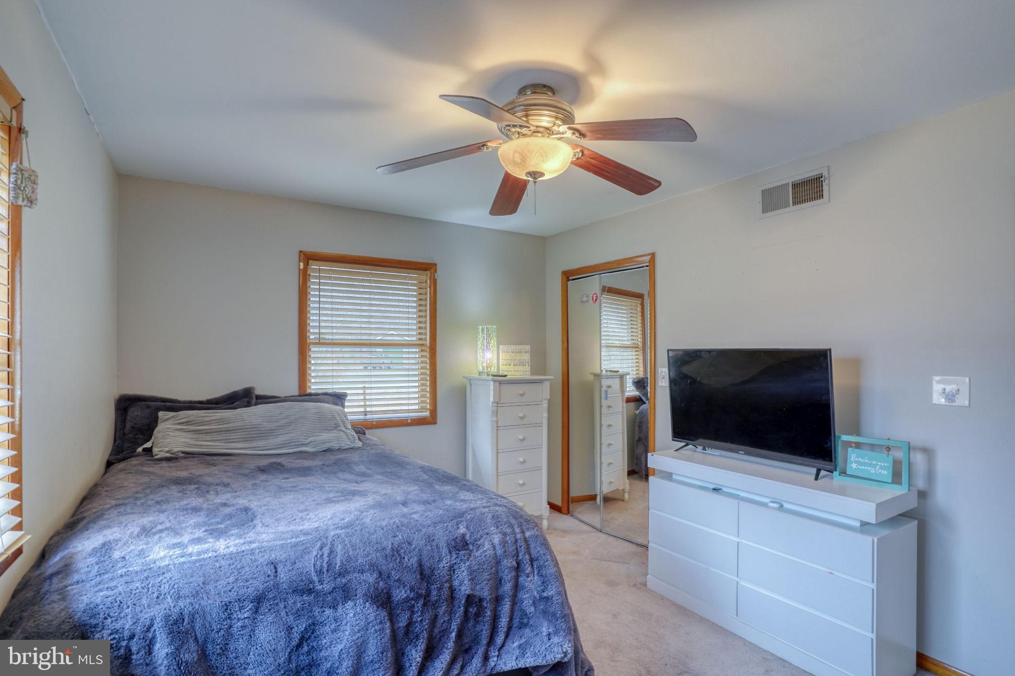 31674 Hickory Manor Road Frankford, DE 19945 - Photo 37 of 53 a bedroom with a bed and a flat screen tv