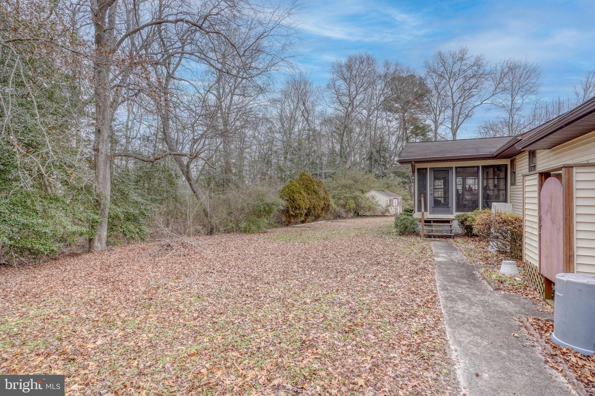 31674 Hickory Manor Road Frankford, DE 19945 - Photo 9 of 53 a view of a house with a yard and pathway