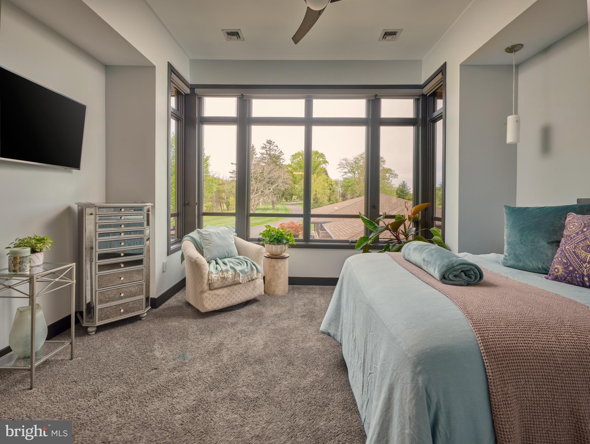 48 Street Road New Hope, PA 18938 - Photo 46 of 119 a spacious bedroom with a bed and large windows