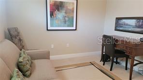 650 Golden Gate Point, Unit 301 Sarasota, FL 34236 - Photo 28 of 31 a bath room with a table and a chair