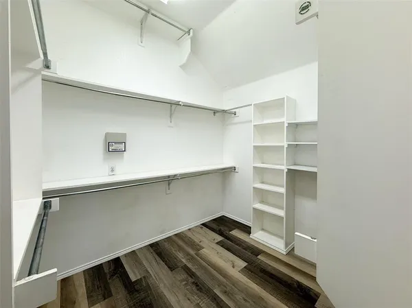 a storage room with wooden floor