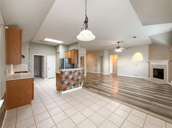 a view of a kitchen with furniture and a chandelier