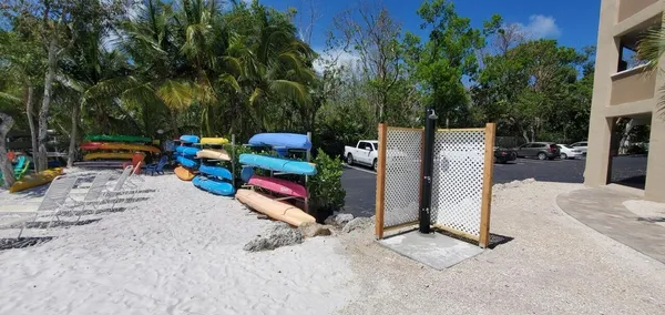 a view of backyard with a table and chairs