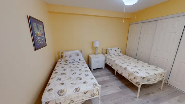 a bedroom with bed and a window