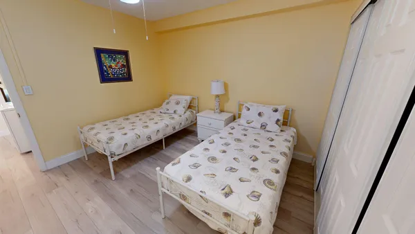 a bedroom with bed and a window