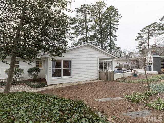4516 Pitt Street Raleigh, NC 27609 - Photo 22 of 24 a backyard of a house with yard and outdoor seating