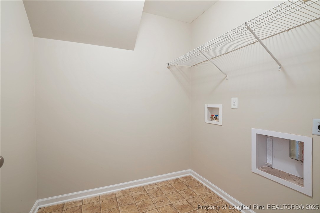720 Cape Fear Road Raeford, NC 28376 - Photo 16 of 35 a view of a small space with racks on the wall