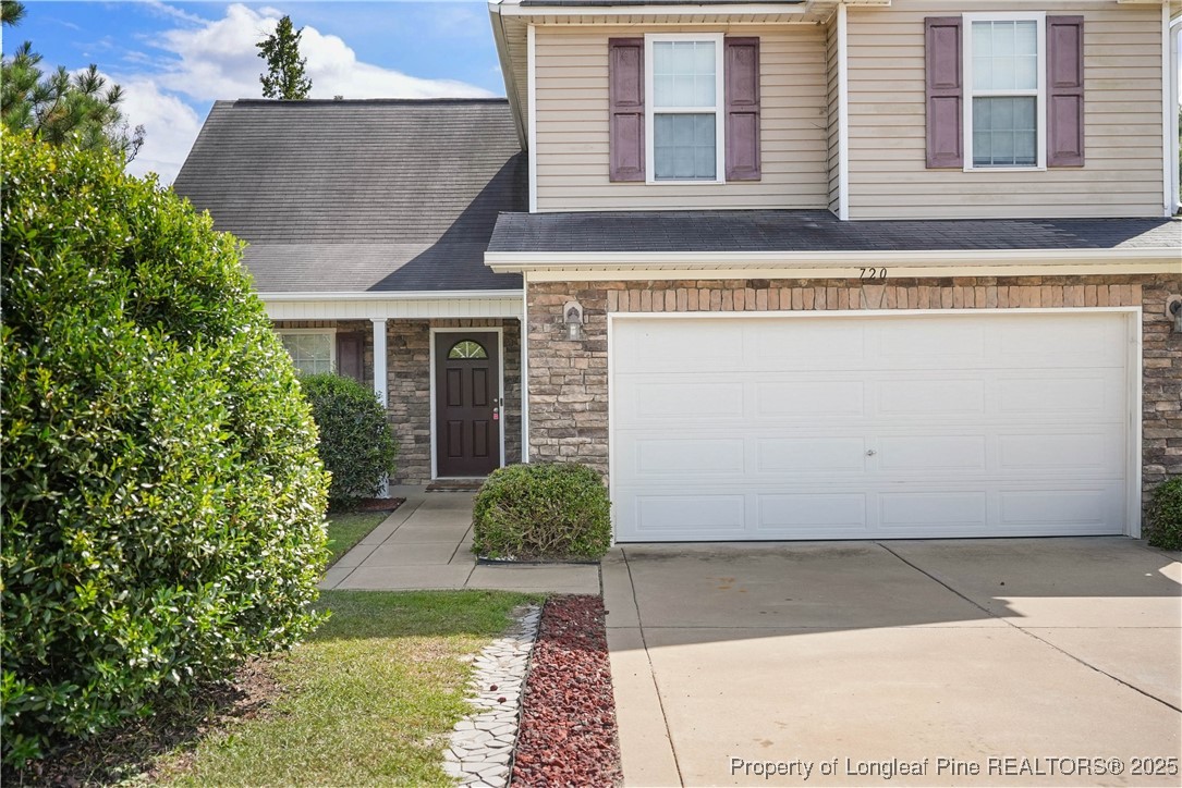 720 Cape Fear Road Raeford, NC 28376 - Photo 3 of 35 a front view of a house with garden