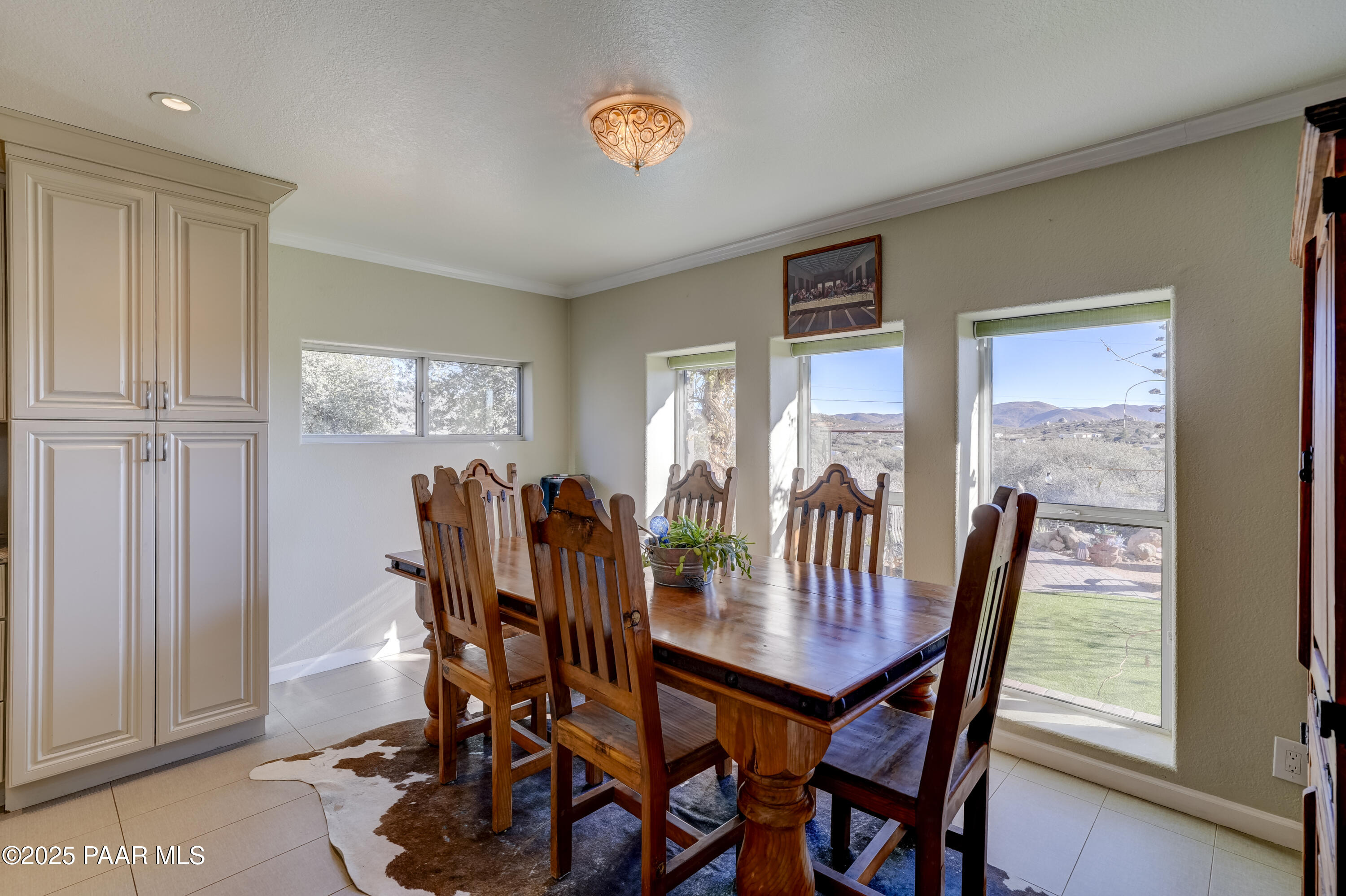 760 Yarber Wash Road Dewey, AZ 86327 - Photo 11 of 66 a view of a dining room with furniture and chandelier