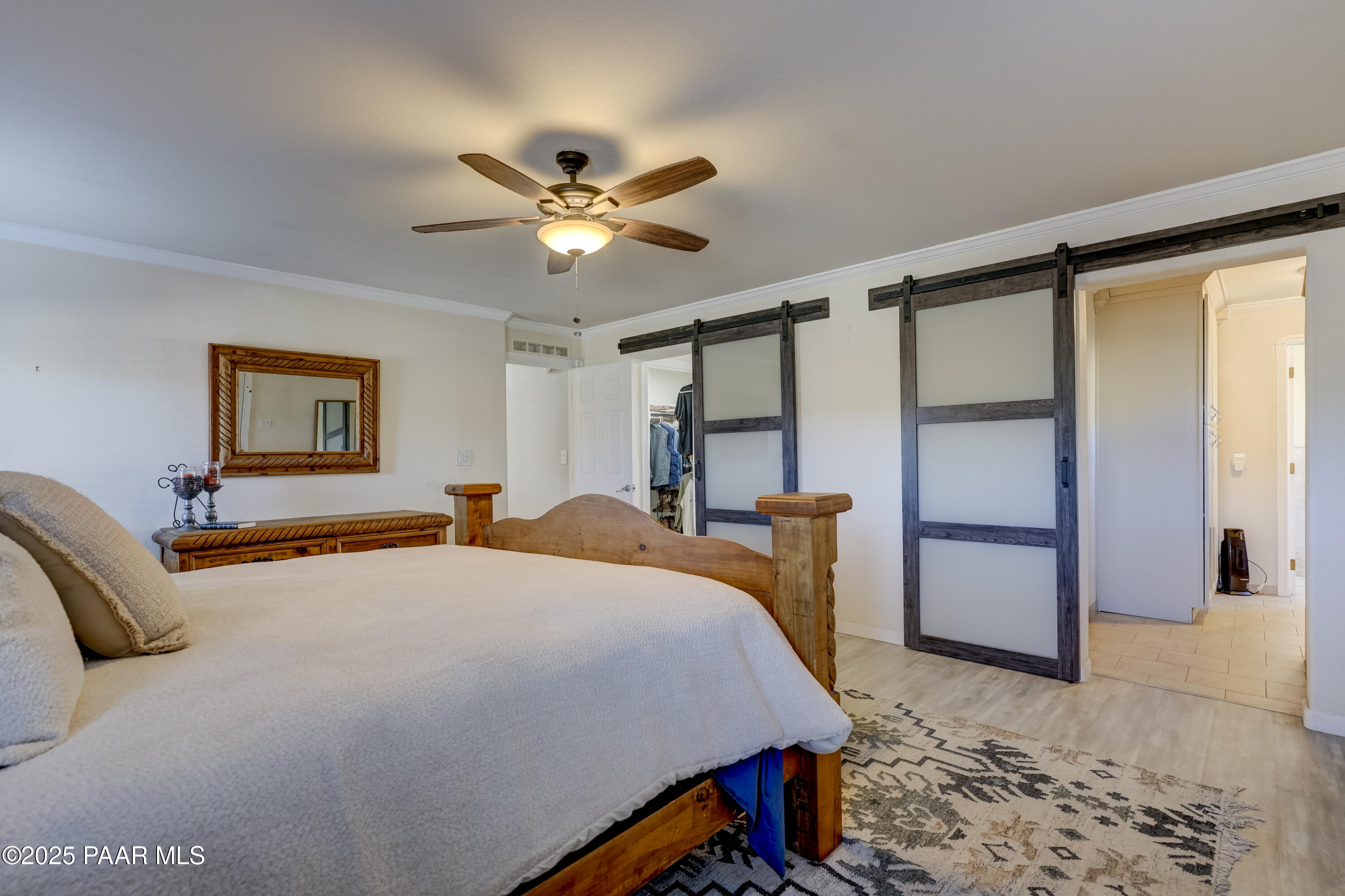 760 Yarber Wash Road Dewey, AZ 86327 - Photo 14 of 66 a bedroom with a bed and a table in it