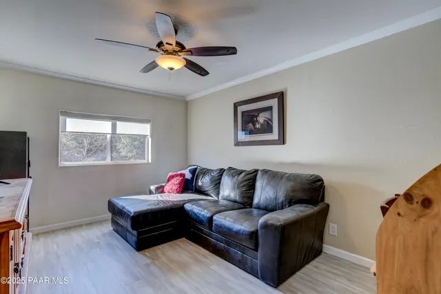 a bathroom with a granite countertop toilet sink and mirror