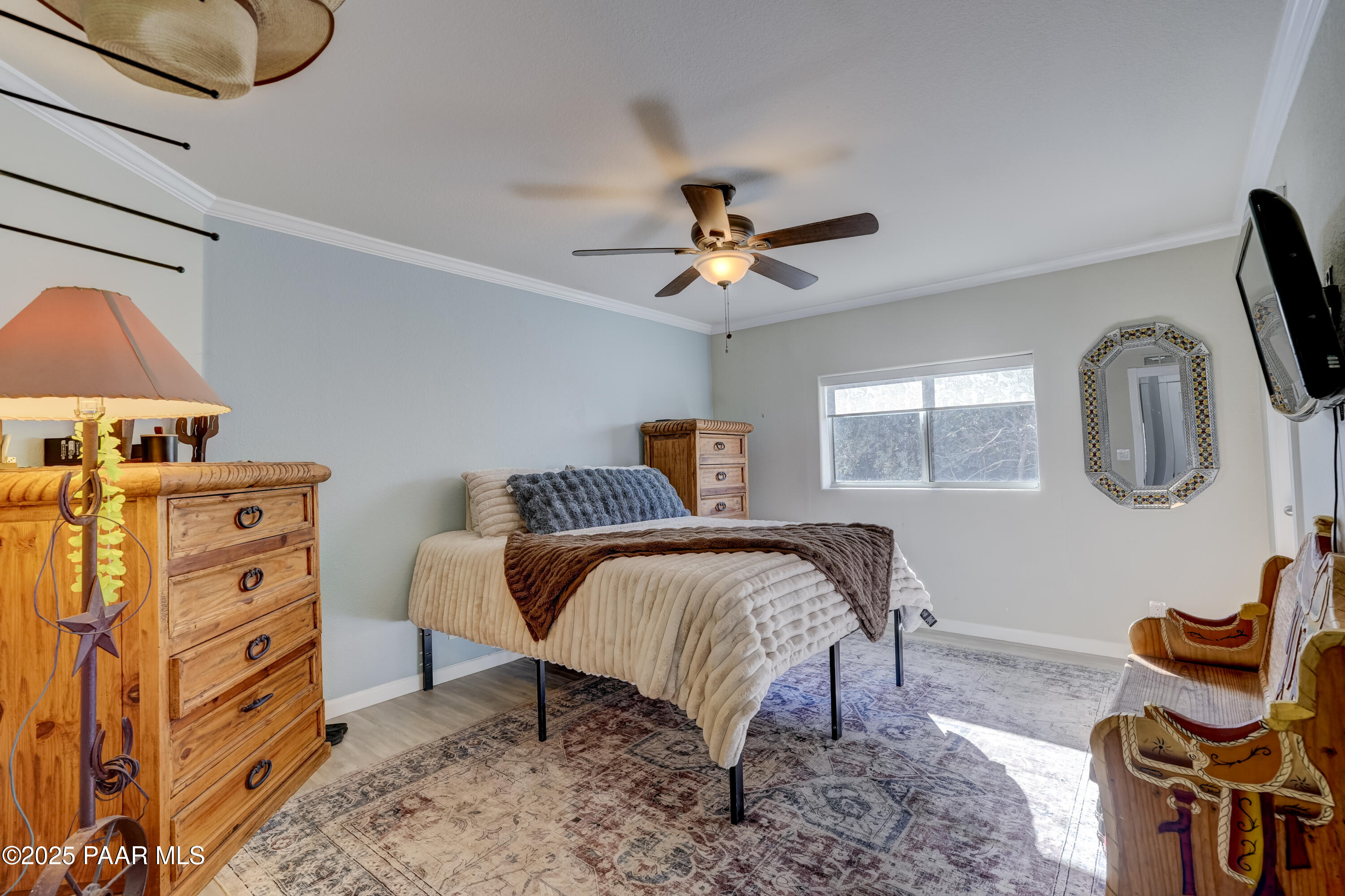760 Yarber Wash Road Dewey, AZ 86327 - Photo 18 of 66 a bedroom with furniture and a window
