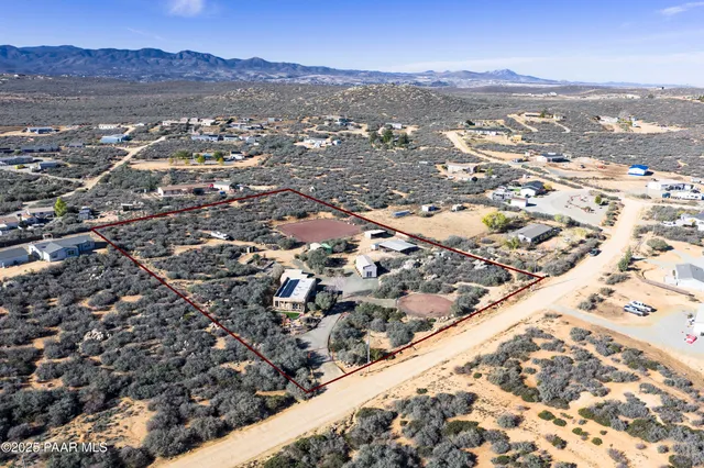 an aerial view of residential house and green space