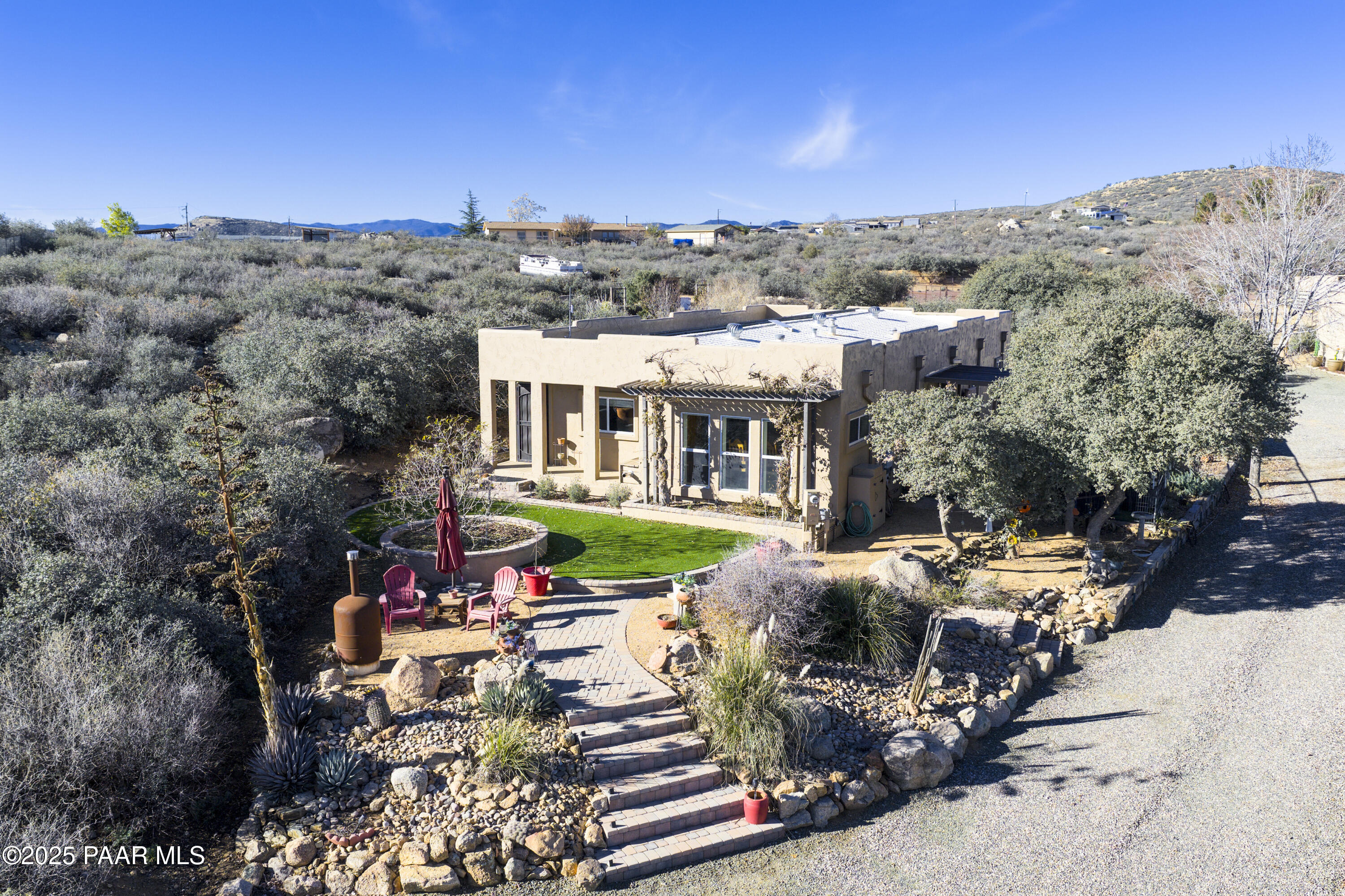 760 Yarber Wash Road Dewey, AZ 86327 - Photo 29 of 66 a view of a patio with furniture and a garden