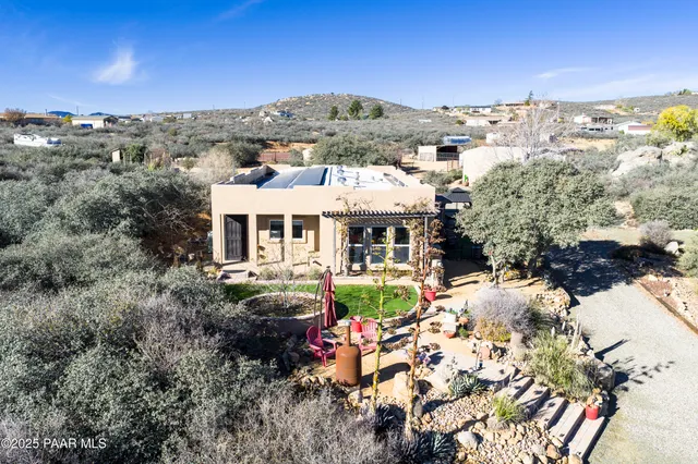an aerial view of residential houses with outdoor space