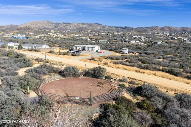 an aerial view of a house with a mountain view