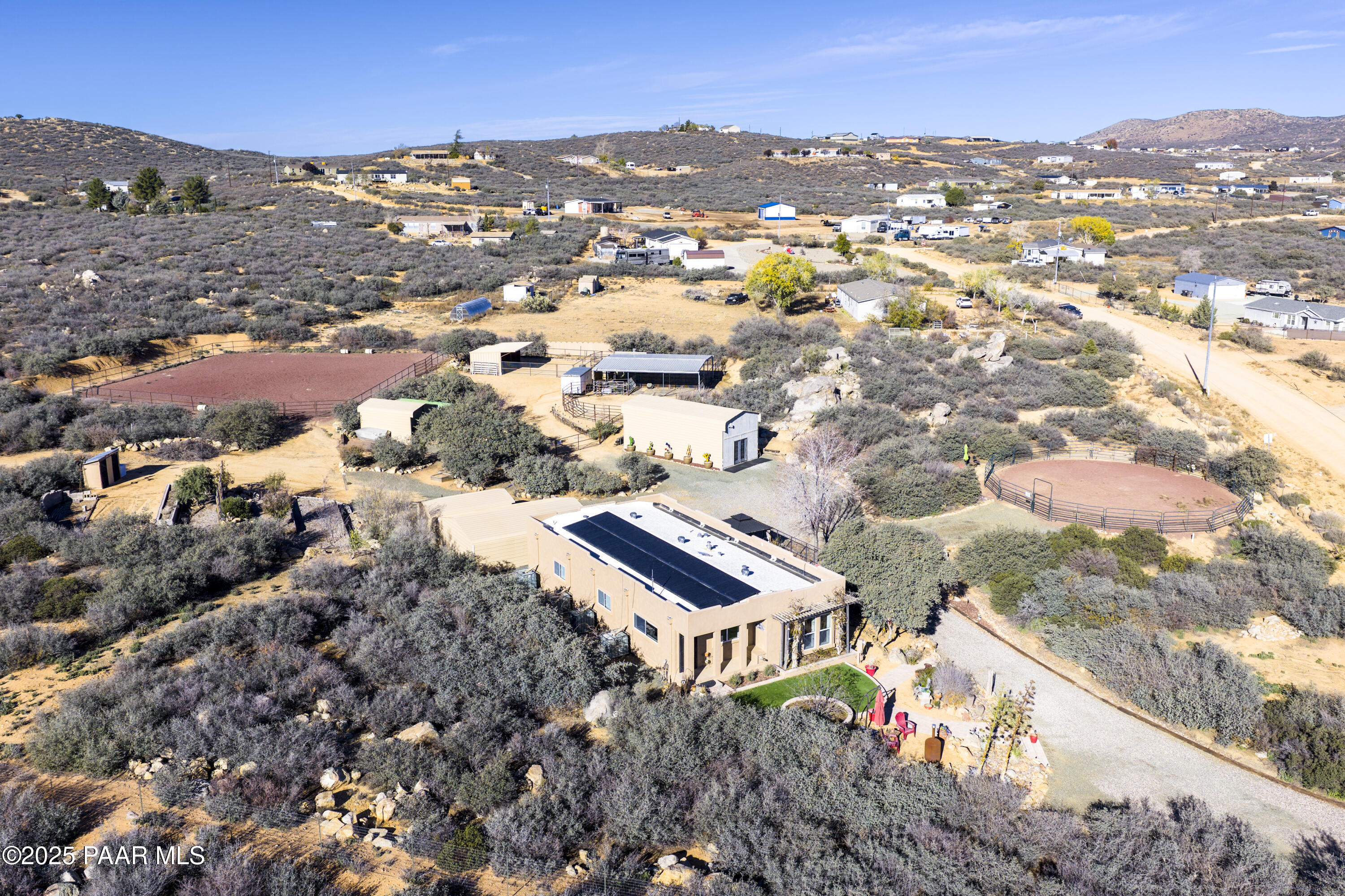 760 Yarber Wash Road Dewey, AZ 86327 - Photo 46 of 66 an aerial view of residential houses with outdoor space and trees