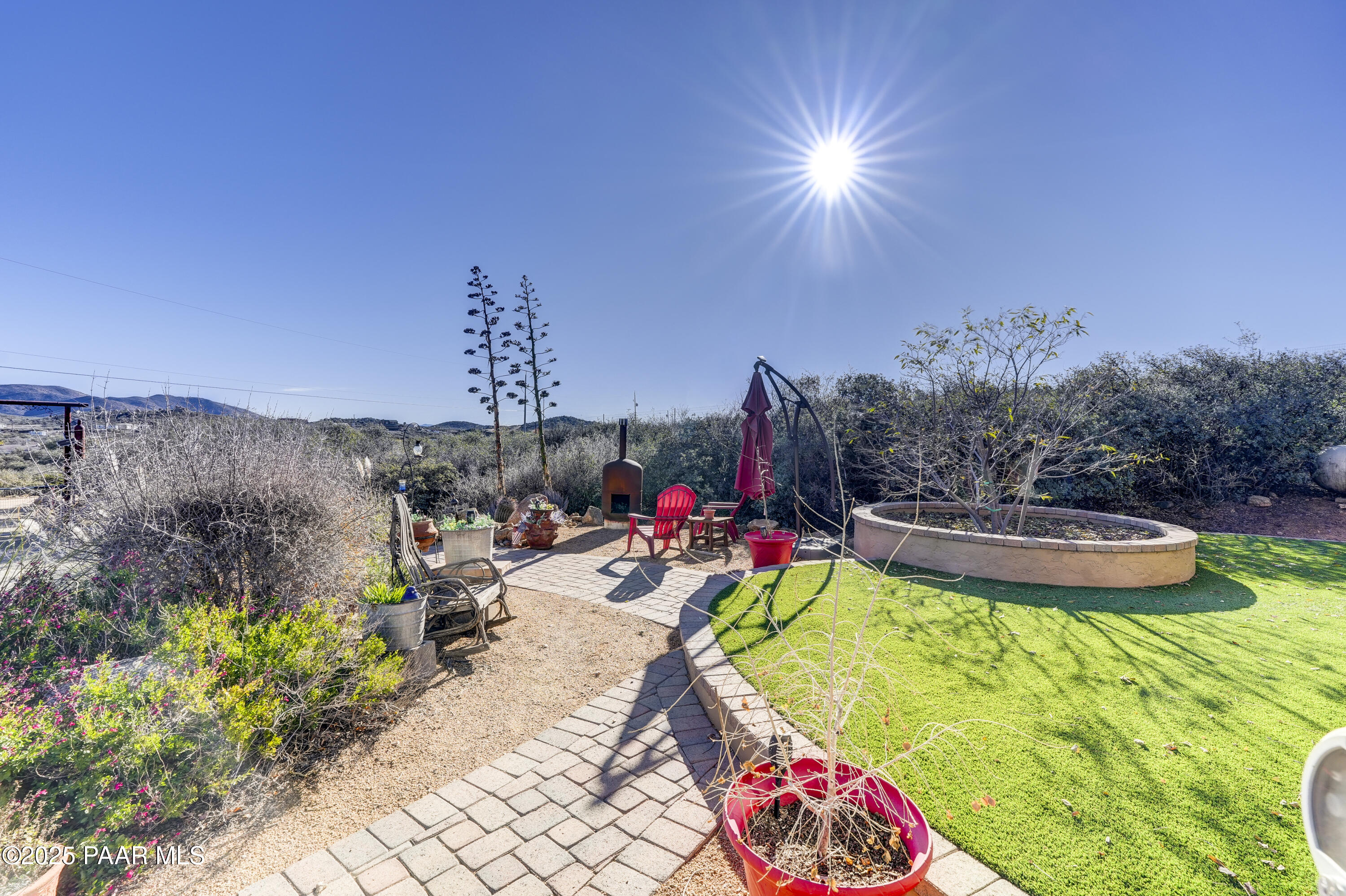 760 Yarber Wash Road Dewey, AZ 86327 - Photo 60 of 66 a view of a chairs and table in a backyard