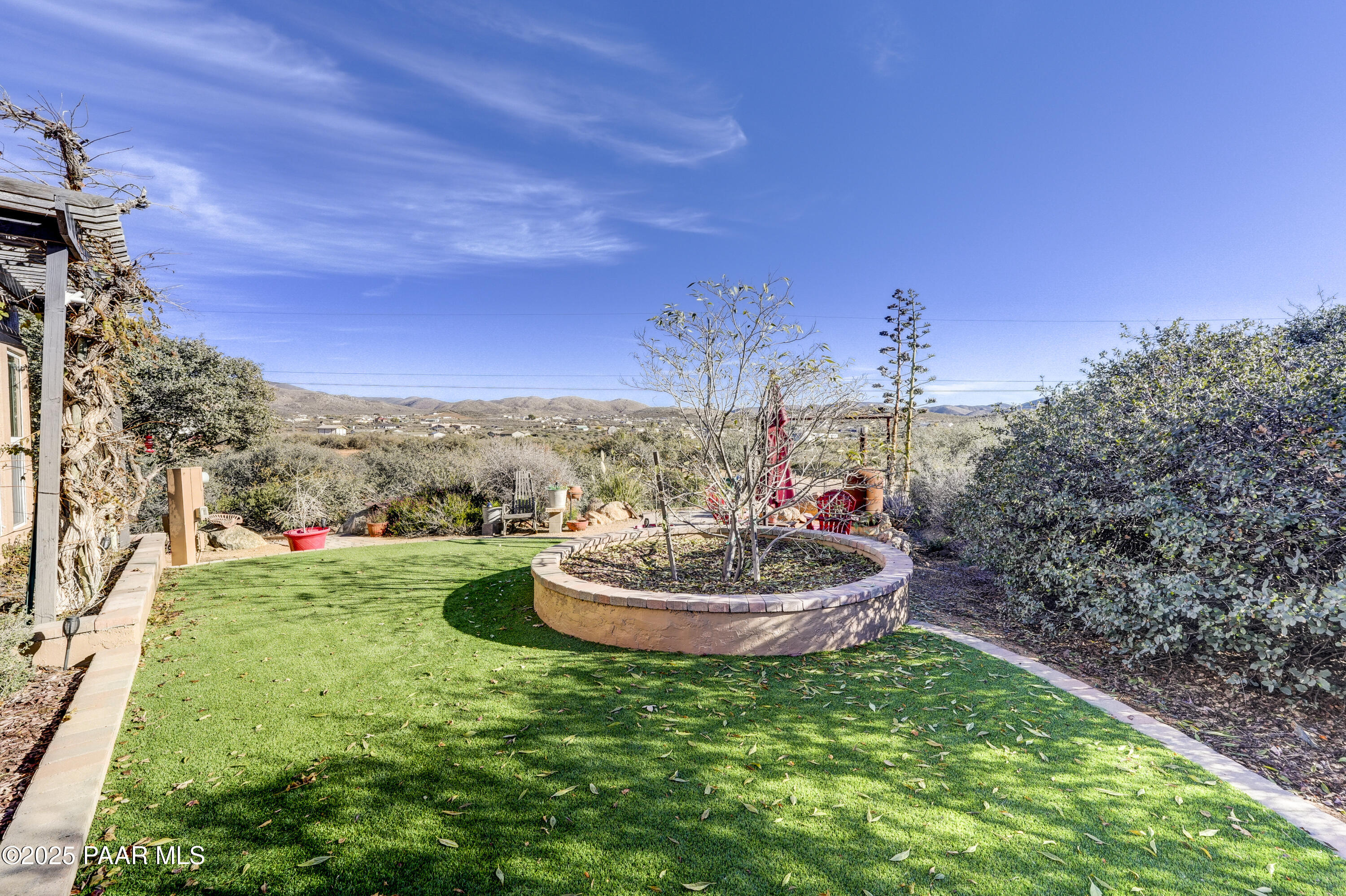 760 Yarber Wash Road Dewey, AZ 86327 - Photo 61 of 66 a view of a backyard with plants and a patio