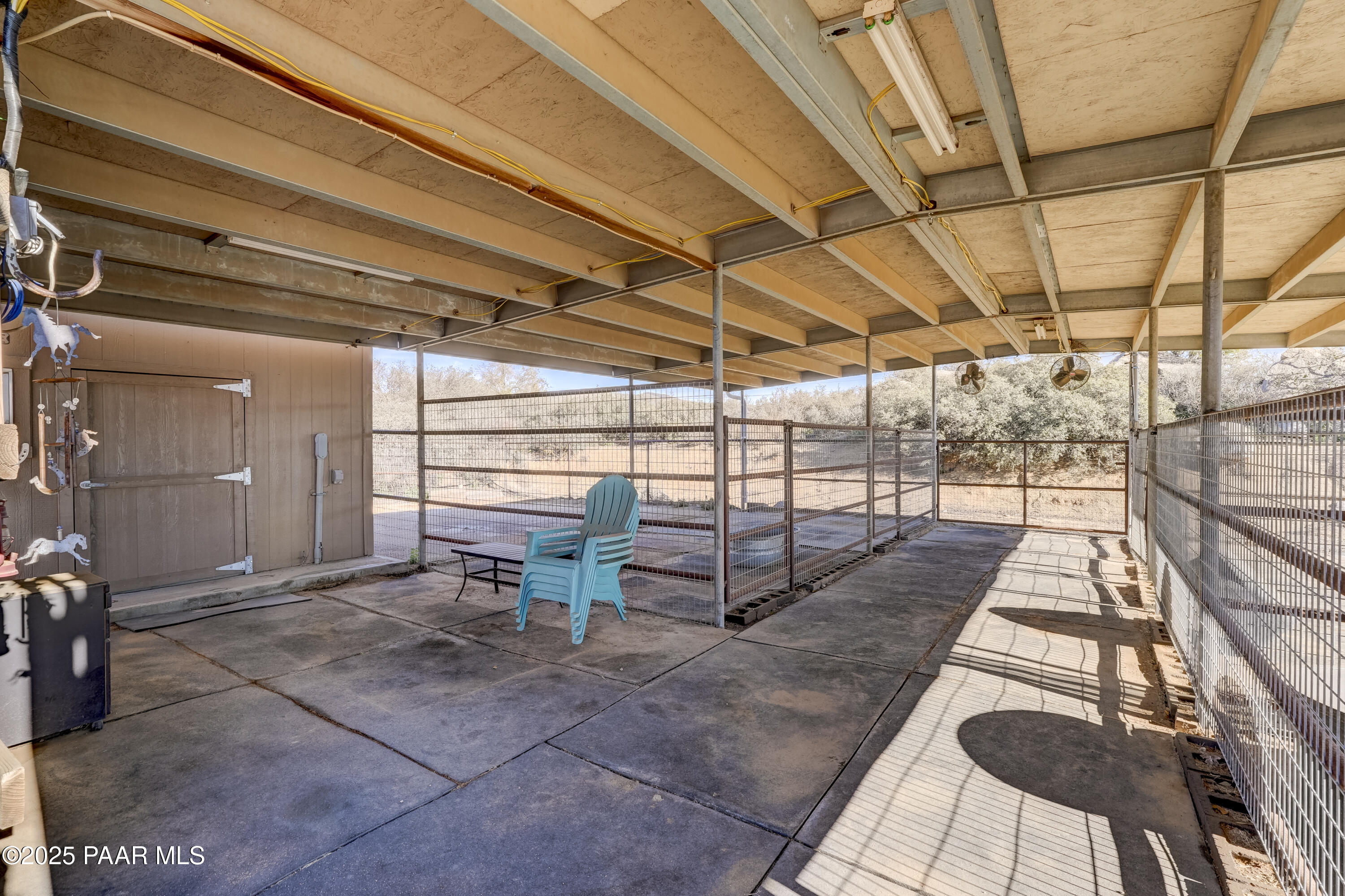 760 Yarber Wash Road Dewey, AZ 86327 - Photo 66 of 66 a view of a garage with wooden floor