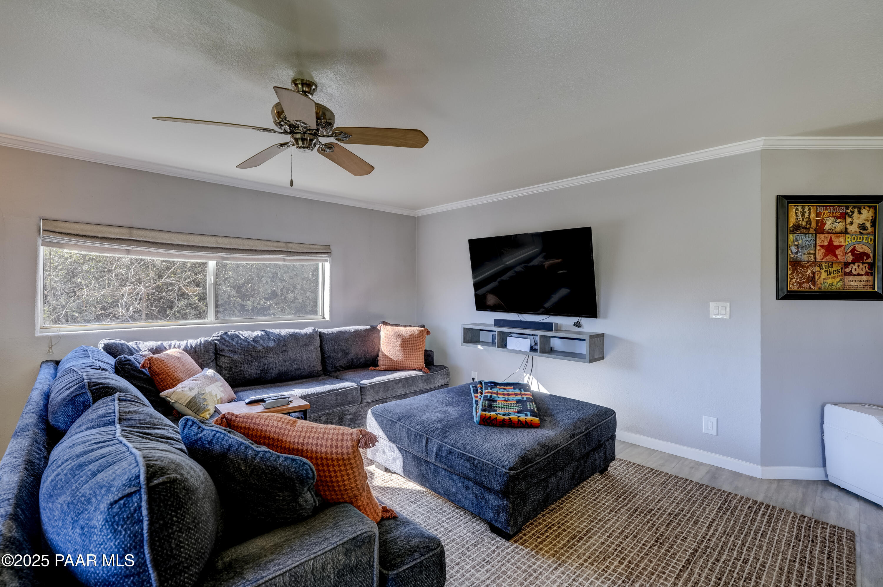 760 Yarber Wash Road Dewey, AZ 86327 - Photo 10 of 66 a living room with furniture and a flat screen tv