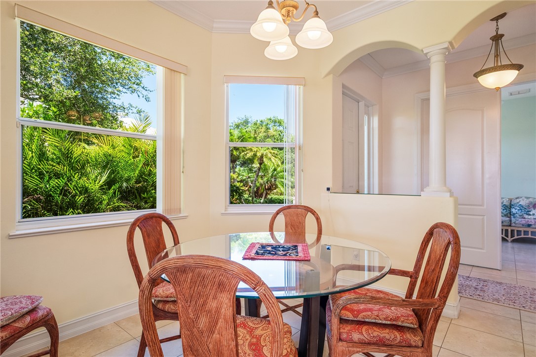 4565 Bridgepointe Way, Unit 142 Vero Beach, FL 32967 - Photo 11 of 36 a view of a dining room with furniture window and outside view
