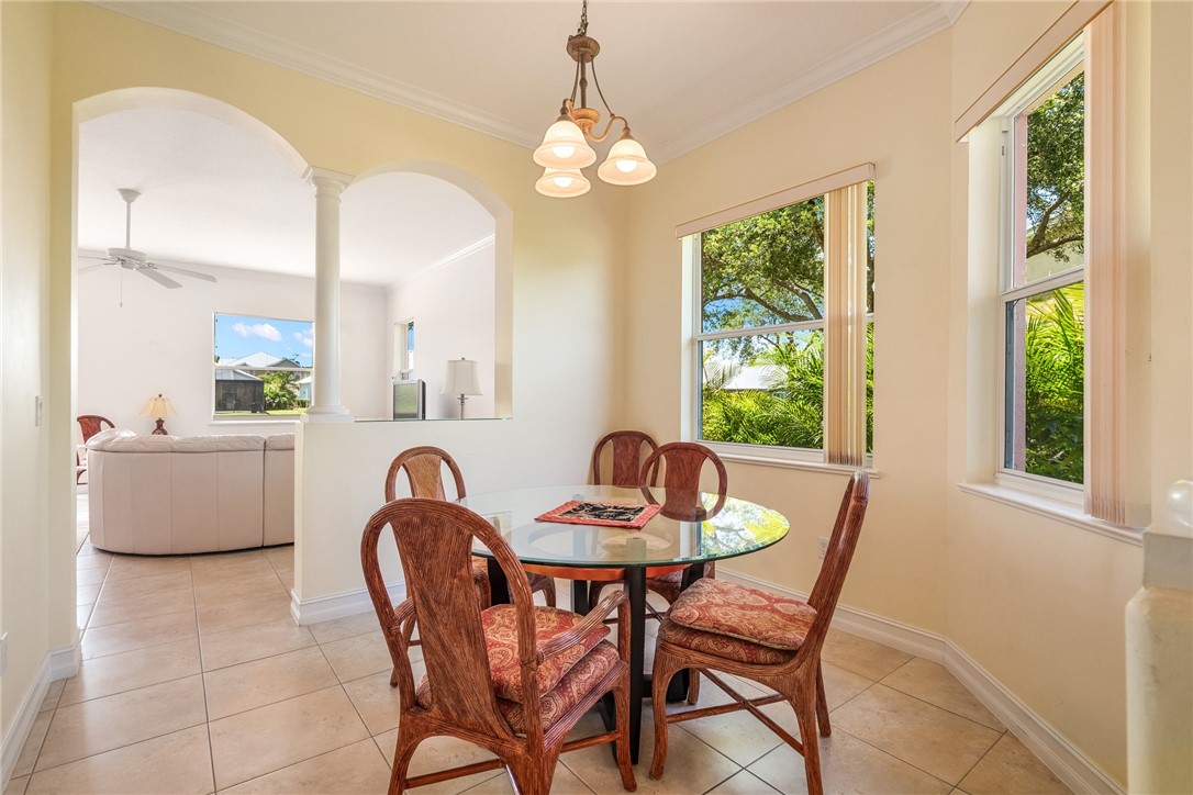 4565 Bridgepointe Way, Unit 142 Vero Beach, FL 32967 - Photo 12 of 36 a dining room with furniture and window